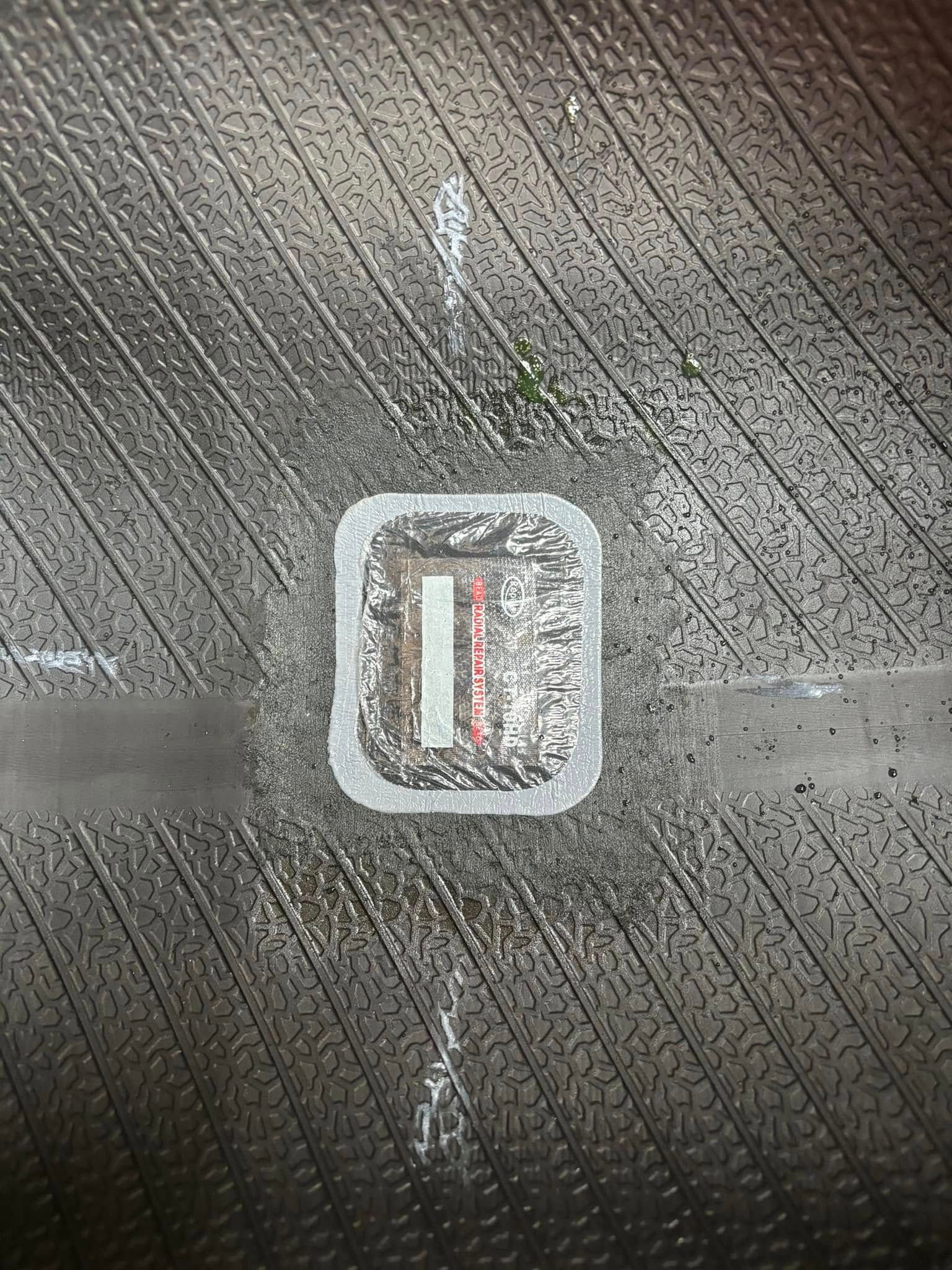 A close up of a tire with the letter i painted on it.