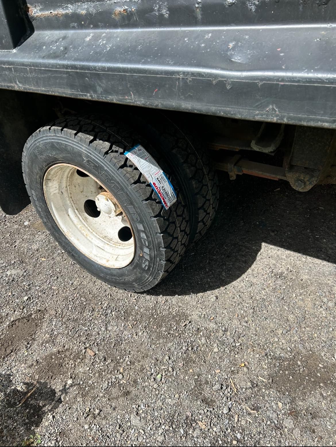 A close up of a tire on a dump truck.
