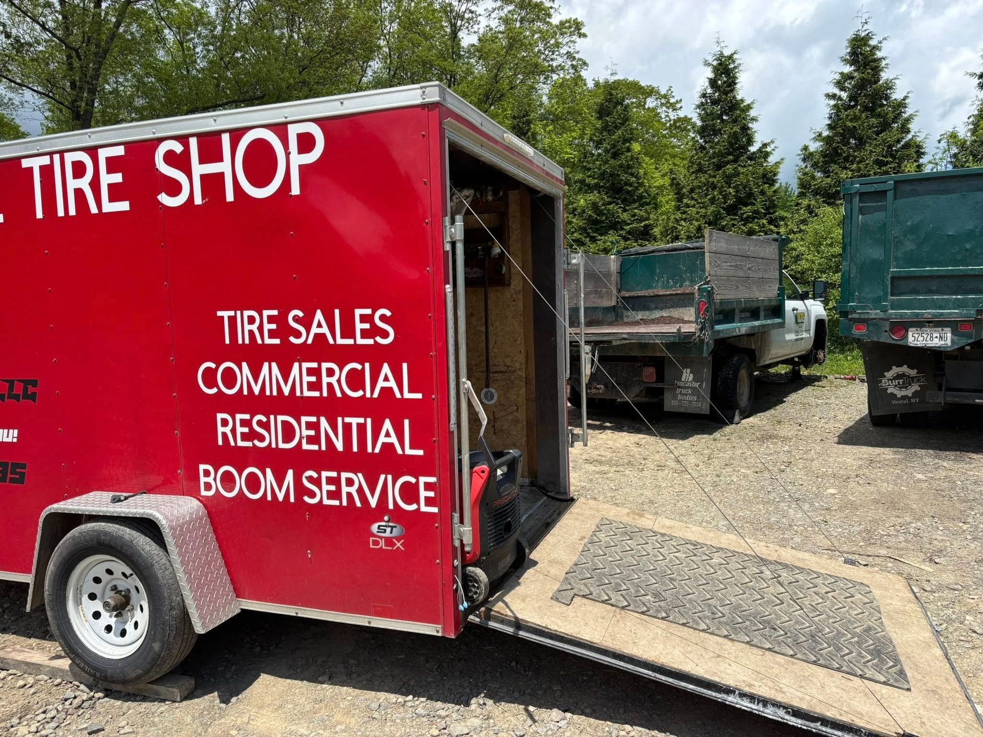 A red trailer with the word tire shop on it