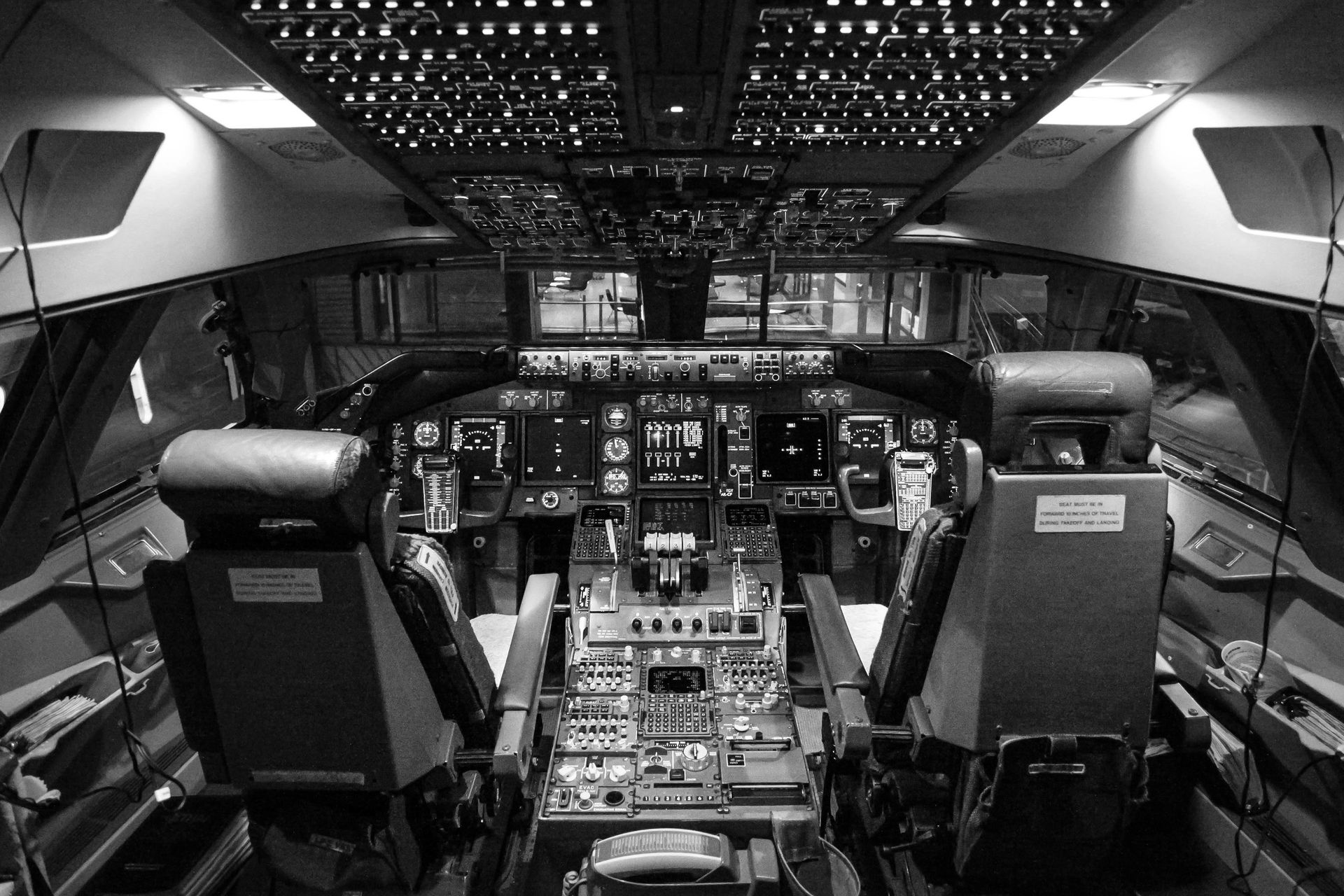 Modern aircraft cockpit displaying complex electronic components and systems used in aerospace