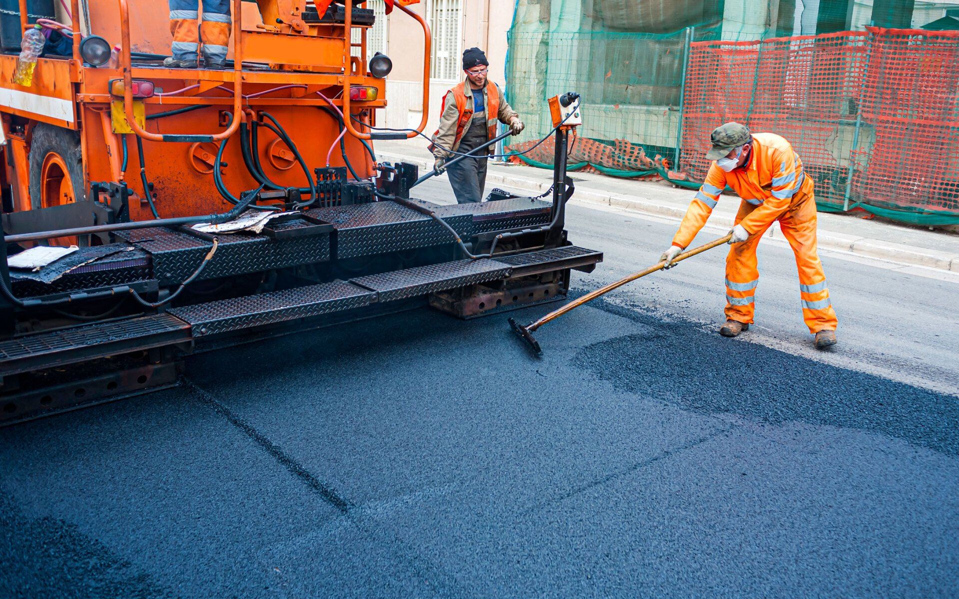Worker Regulate Tracked Paver Laying Asphalt — Broward and Palm Beach County — 1st Lady Paving LLC