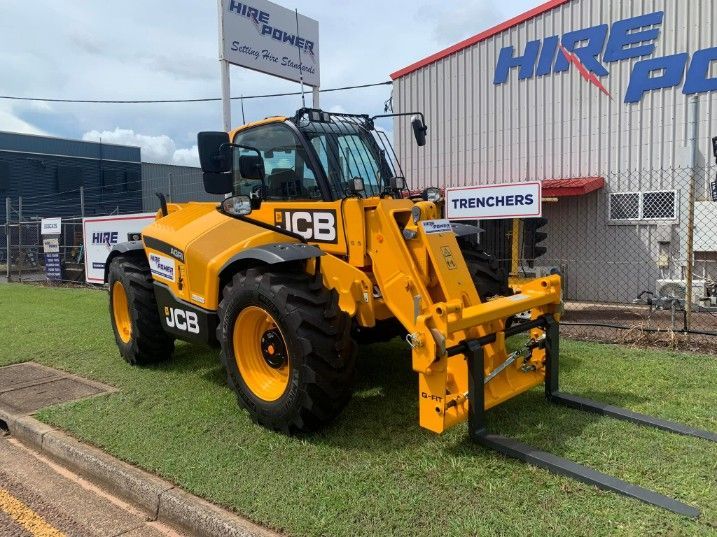 A Yellow Forklift is Parked in Front of a Building — Hire Power NT in Berrimah, NT