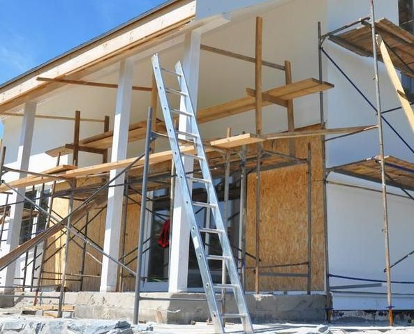 A House Under Construction With Scaffolding and a Ladder — Hire Power NT in Berrimah, NT