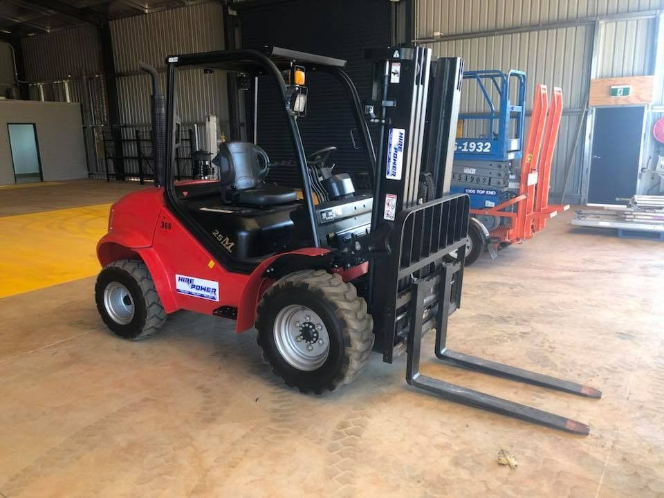 A Red Forklift is Parked in a Warehouse — Hire Power NT in Berrimah, NT