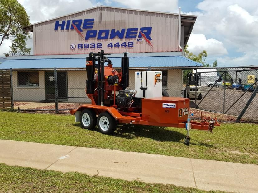 A Trailer is Parked in Front of a Building That Says Hire Power — Hire Power NT in Berrimah, NT