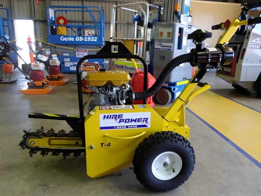 A Yellow Hire Power Machine is Parked in a Garage — Hire Power NT in Berrimah, NT