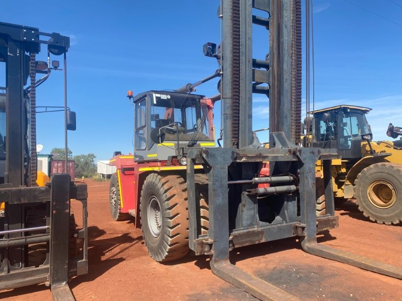 Two Forklifts Are Parked Next To Each Other On A Dirt Road — Advanced Weighing Technology NT Pty Ltd In Kununurra, WA