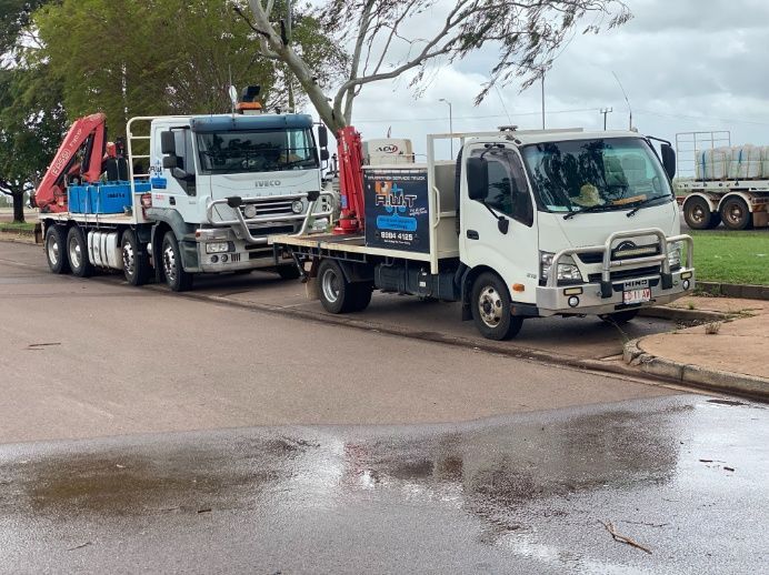 Two Trucks Are Parked On The Side Of The Road — Advanced Weighing Technology NT Pty Ltd In Katherine, NT