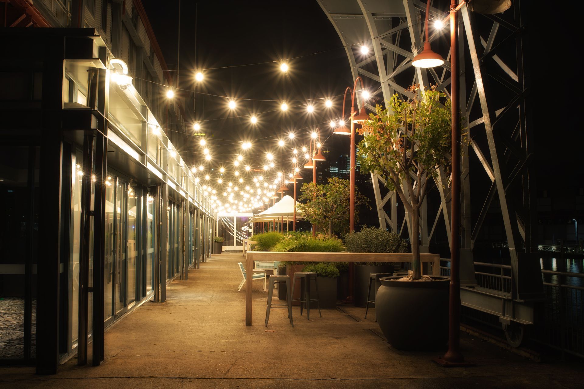 A Row Of Lights Hanging From The Ceiling Of A Building At Night – Sydney, NSW - Dallimont Electrical