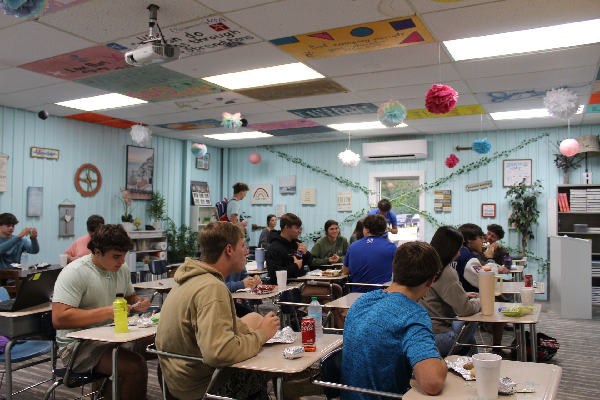 A colorful classroom full of students learning. 