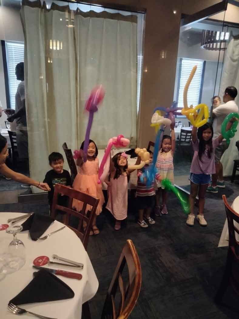 Happy Kids Holding Animal Balloon