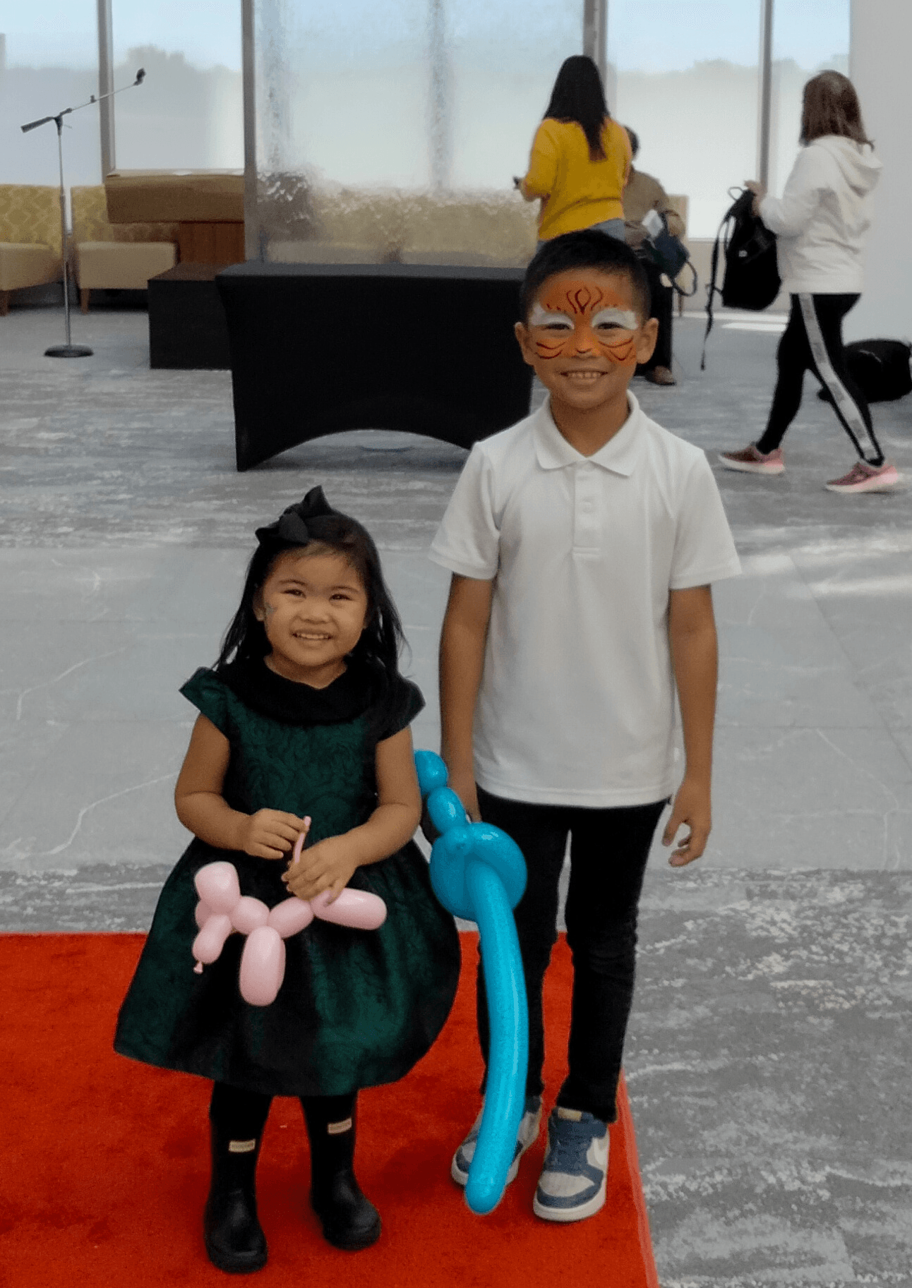 Children Smiling Holding Customized Balloon