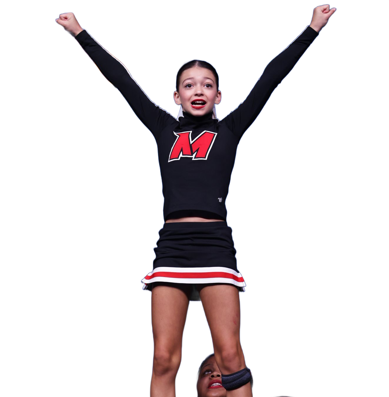 Two cheerleaders in black and red uniforms perform a mount, with one standing on the shoulders of the other.