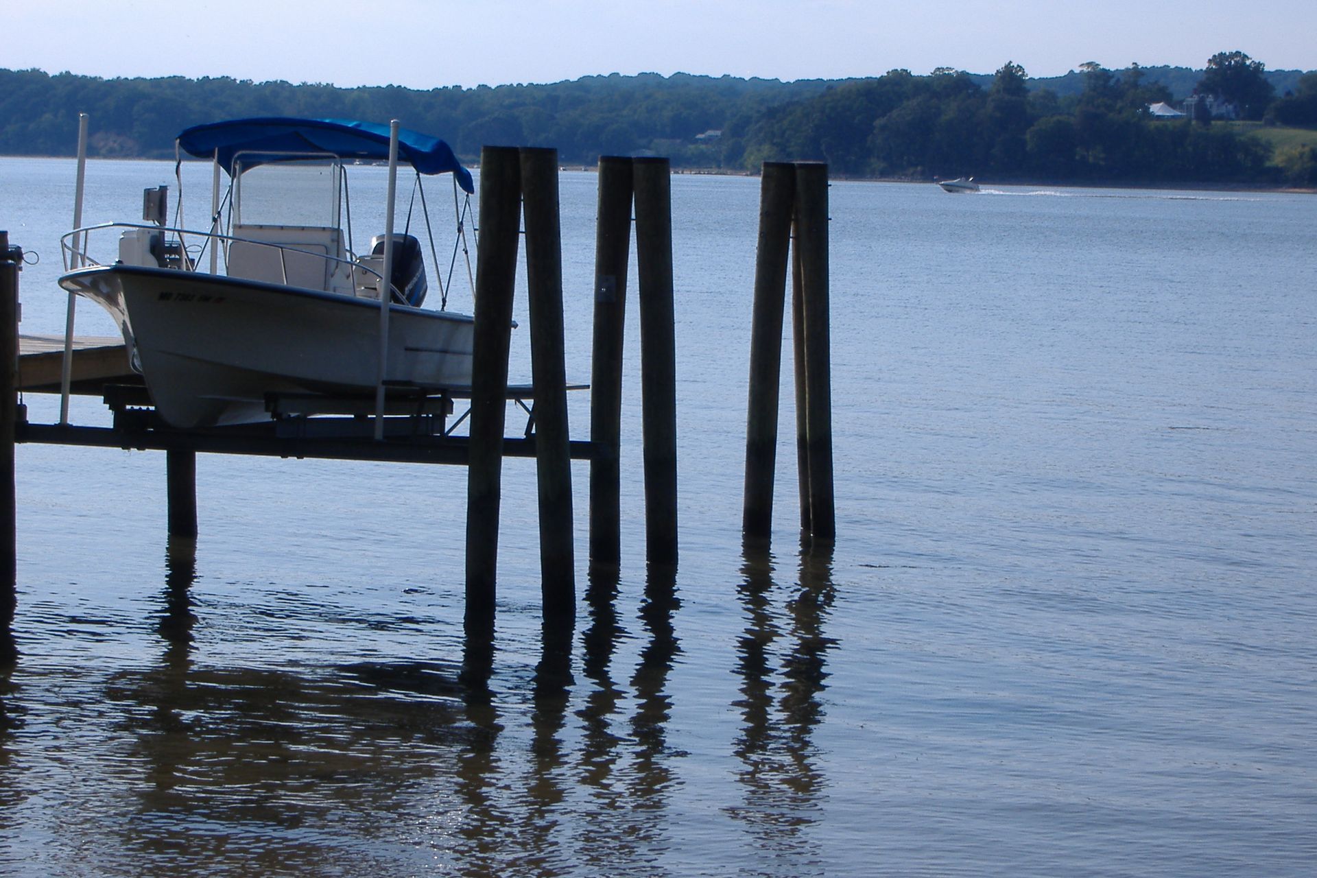 A boat is docked at a dock in the water