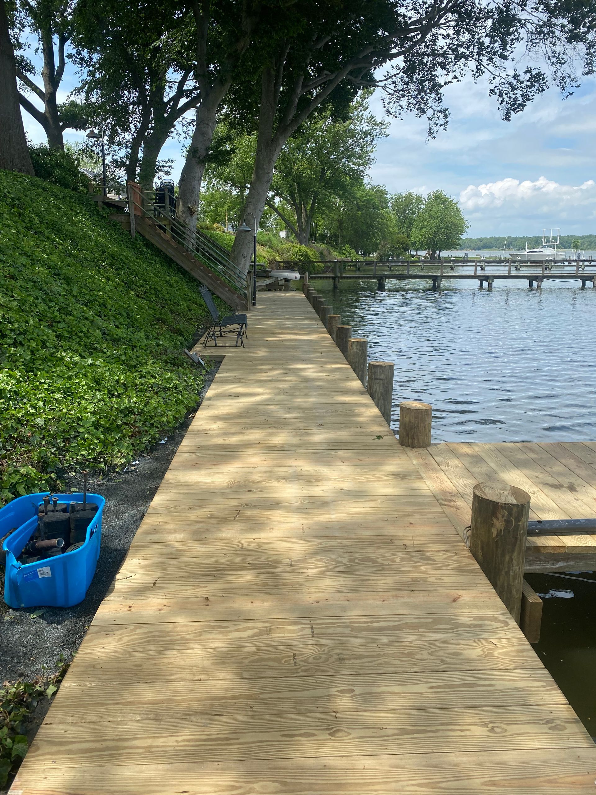A wooden dock leading to a body of water.