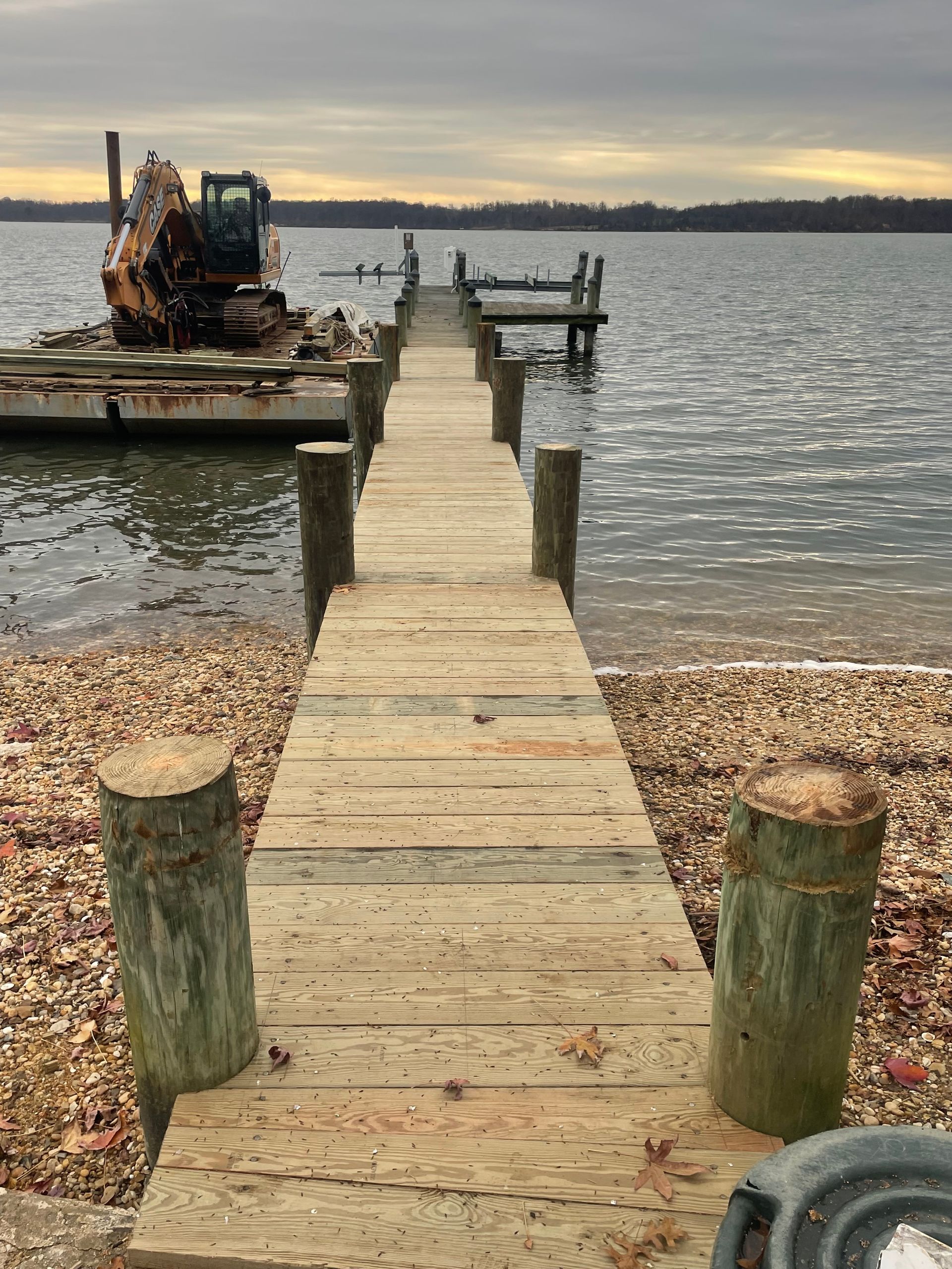 A wooden dock leading to a body of water.