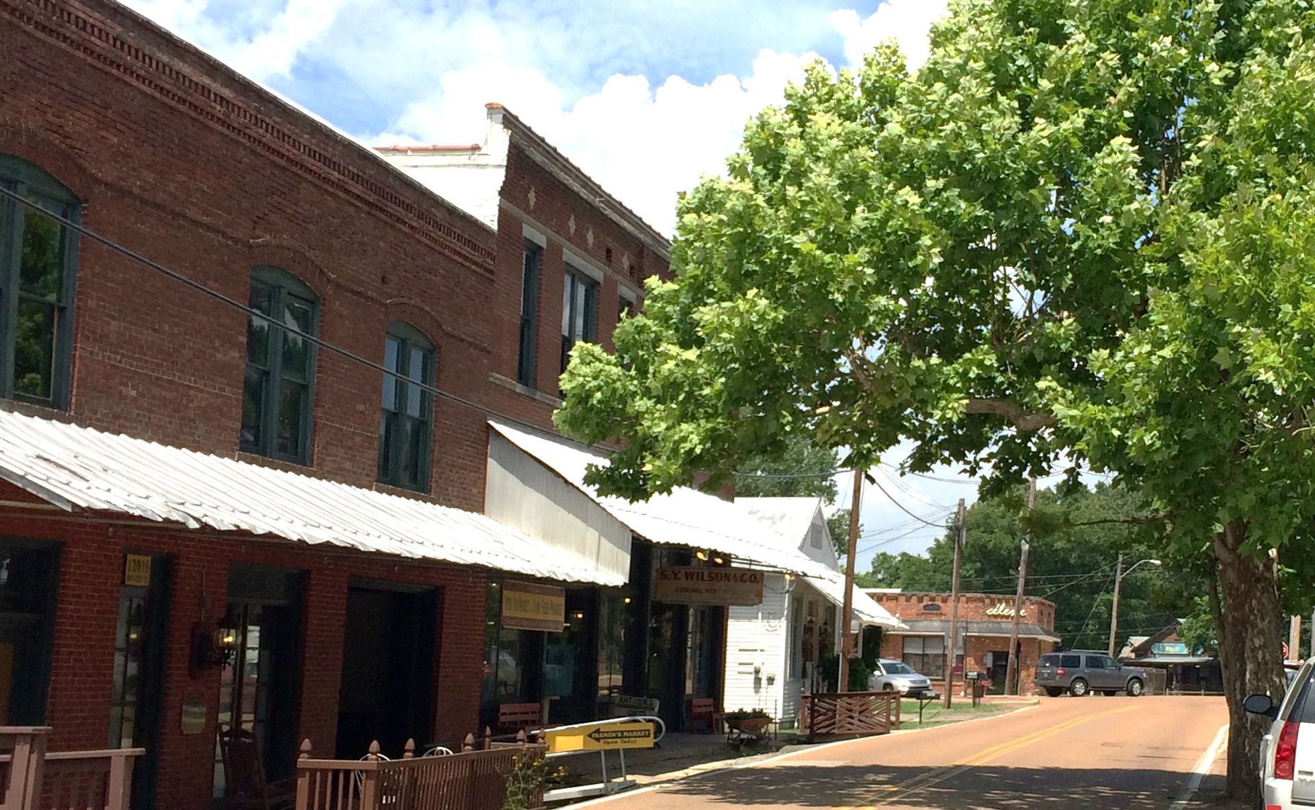 A brick building with a white awning on the side of it