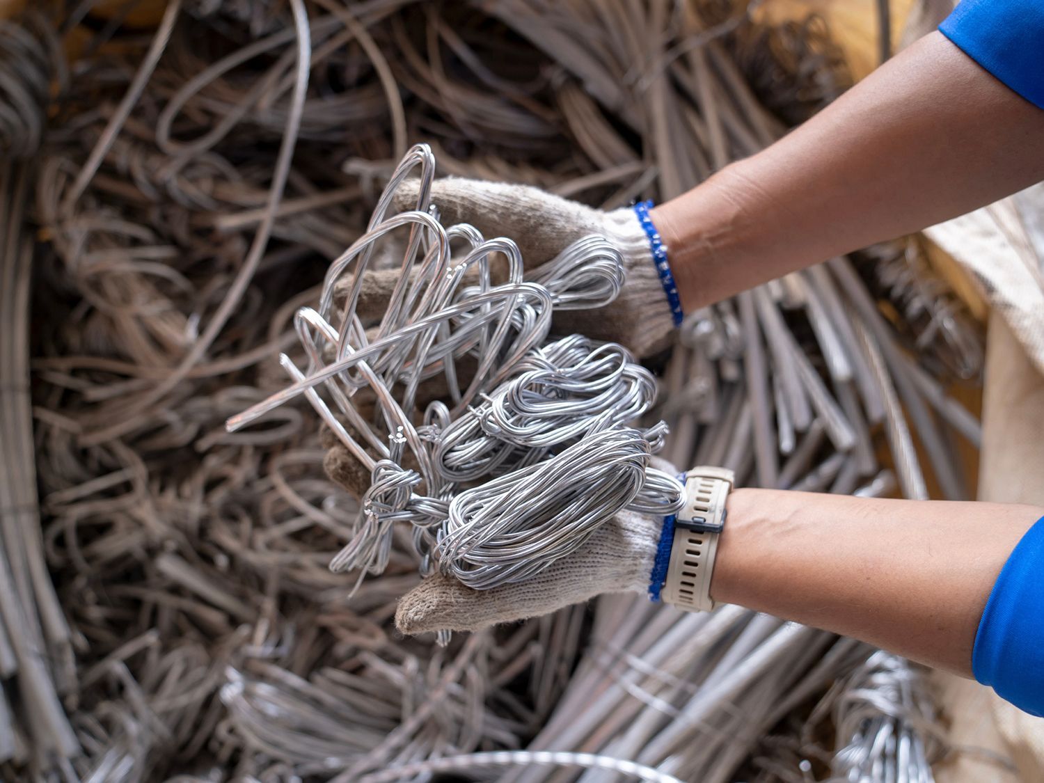 A person is holding a bunch of wires in their hands.
