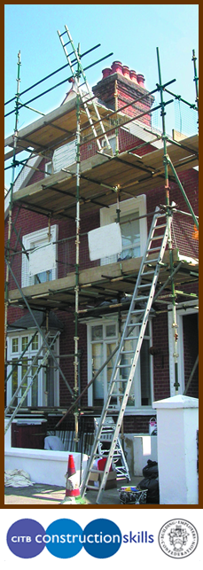 Building repairs being carried out on two storey house 