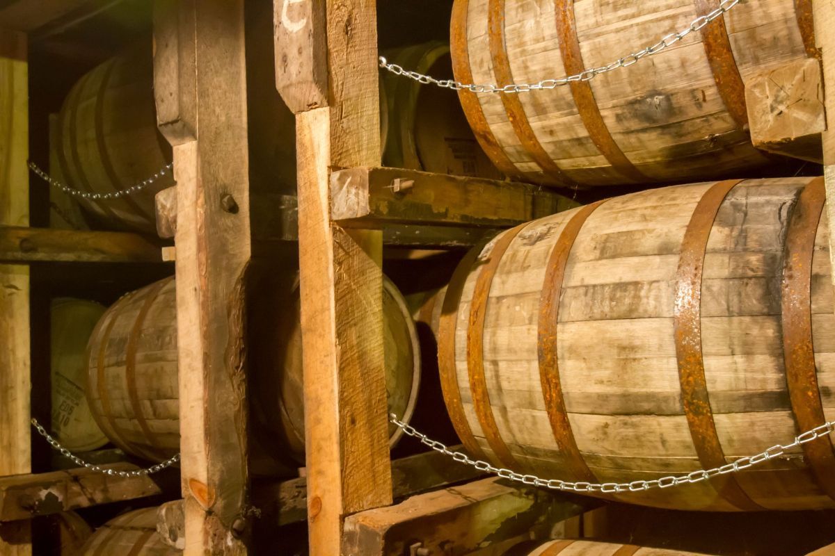 A bunch of wooden barrels stacked on top of each other