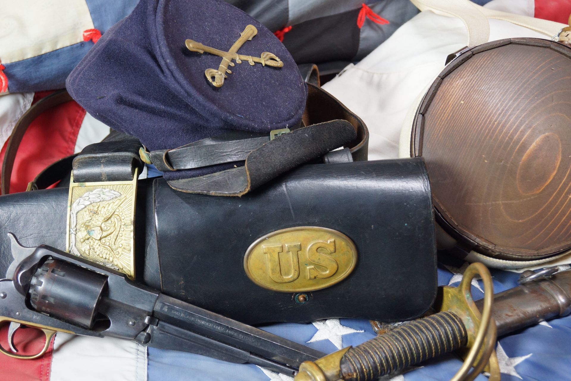 Civil War military gear: blue kepi hat, leather belt and cartridge box with 