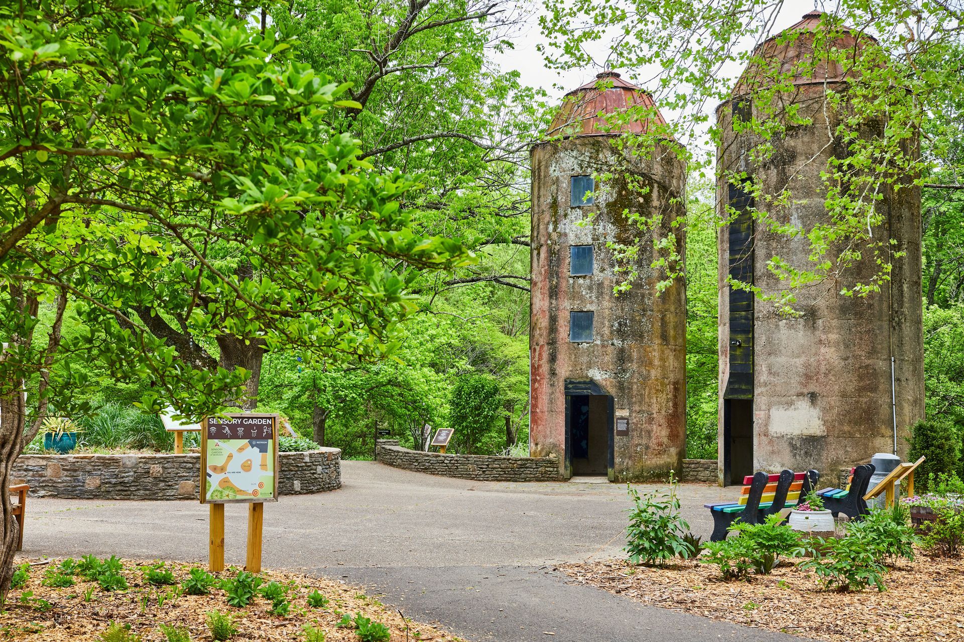 A man is swinging a golf club on a golf course.