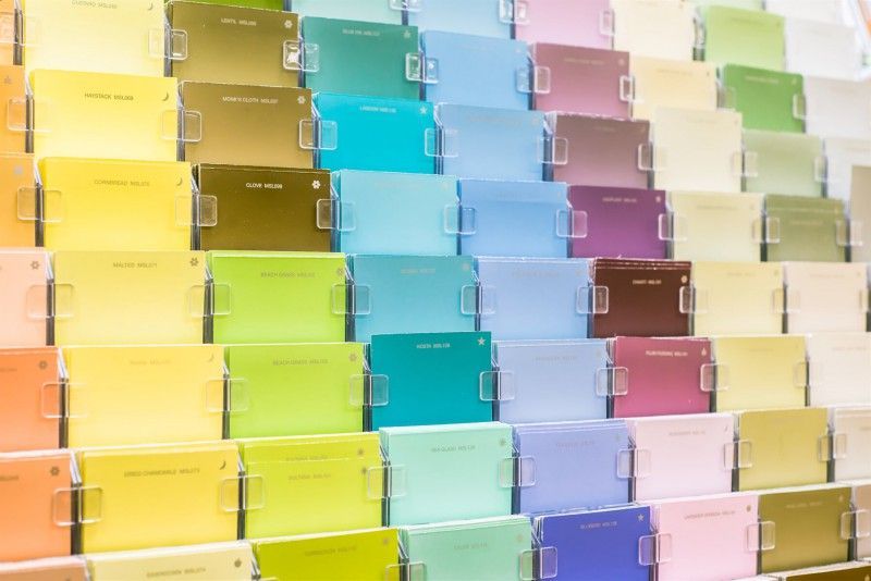 There are Many Different Colors of paint on Display in a Store — Painting Services in Rockhampton, QLD