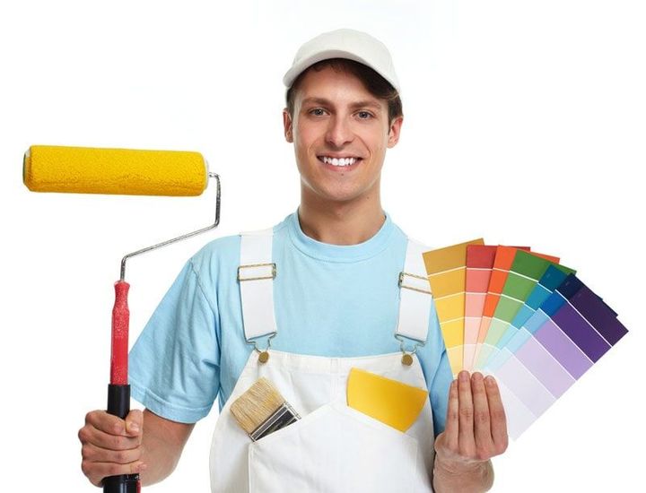 A Man is Holding a Paint Roller and a Palette of Colors  — Painting Services in Rockhampton, QLD