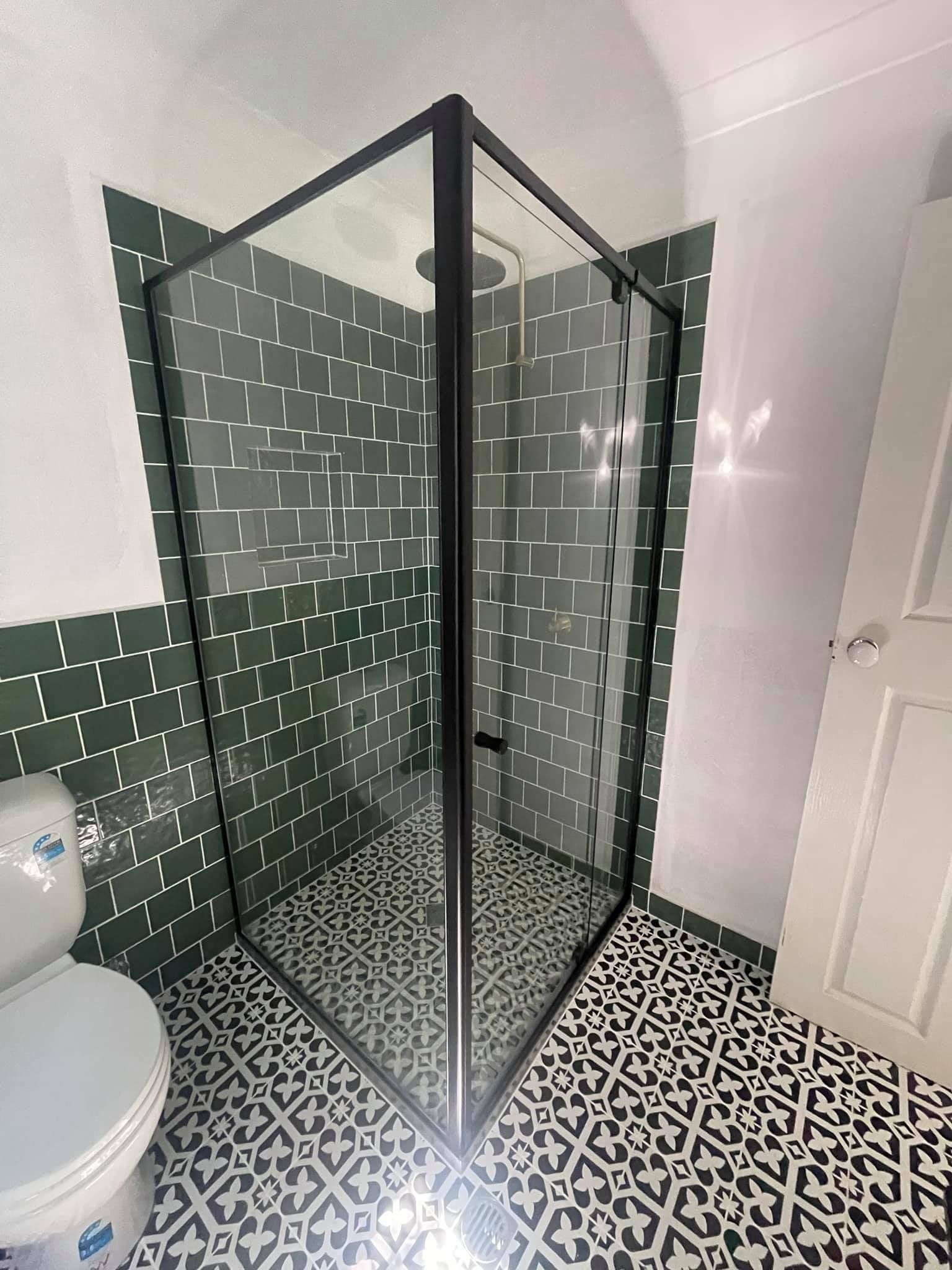 Bathroom With Green Tiled Walls — Moore Park Beach Glass & Security in Moore Park Beach, QLD