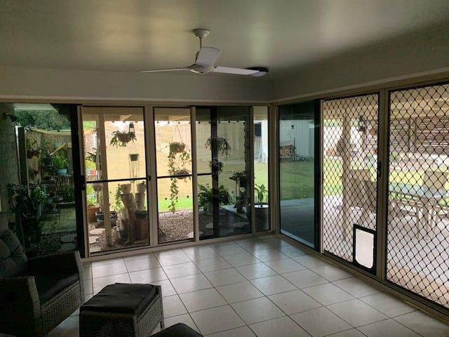 Living Room With Sliding Glass Doors — Moore Park Beach Glass & Security