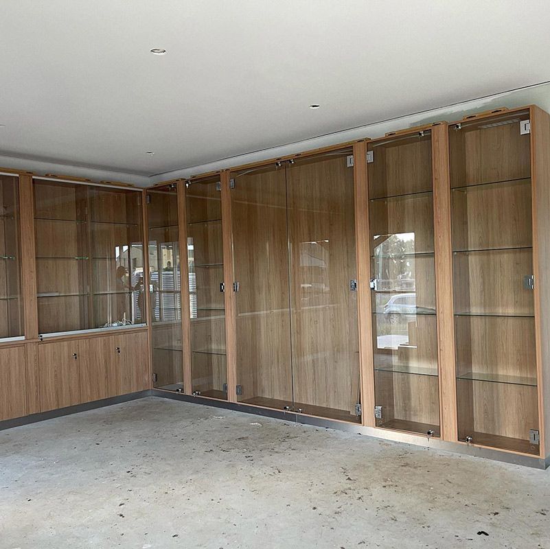 Wooden Cabinets With Glass Doors — Moore Park Beach Glass & Security
