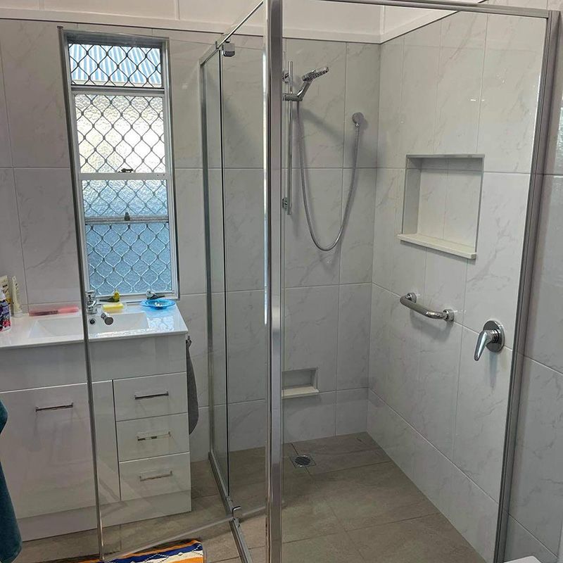 Bathroom With a Shower and a Sink — Moore Park Beach Glass & Security