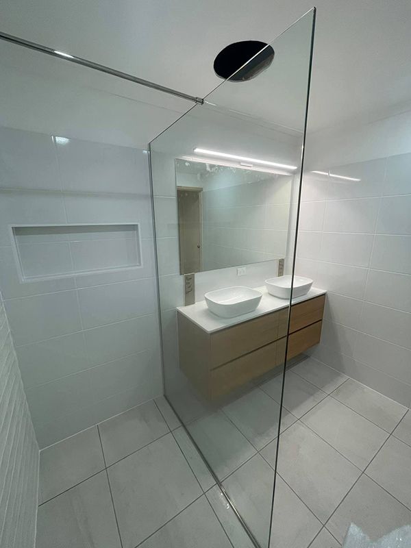 Bathroom With Sinks and a Walk in Shower — Moore Park Beach Glass & Security