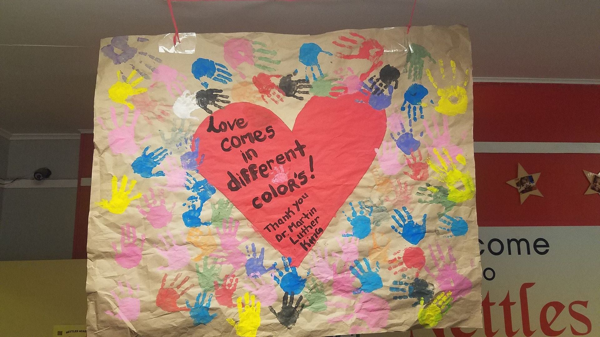 a poster that says love comes in different colors