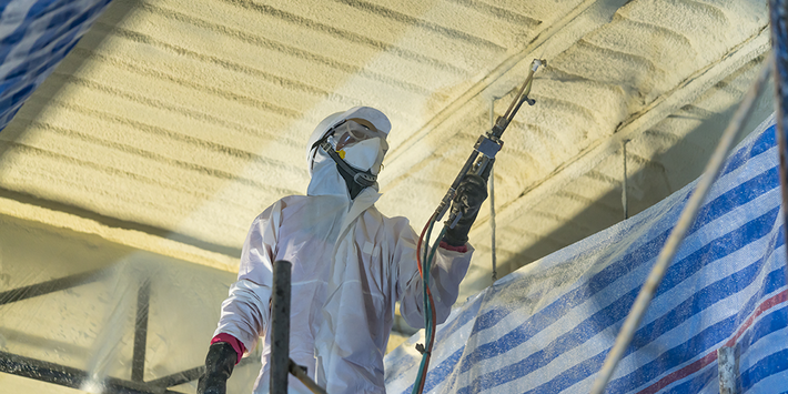 Man Spraying Foam Insulation