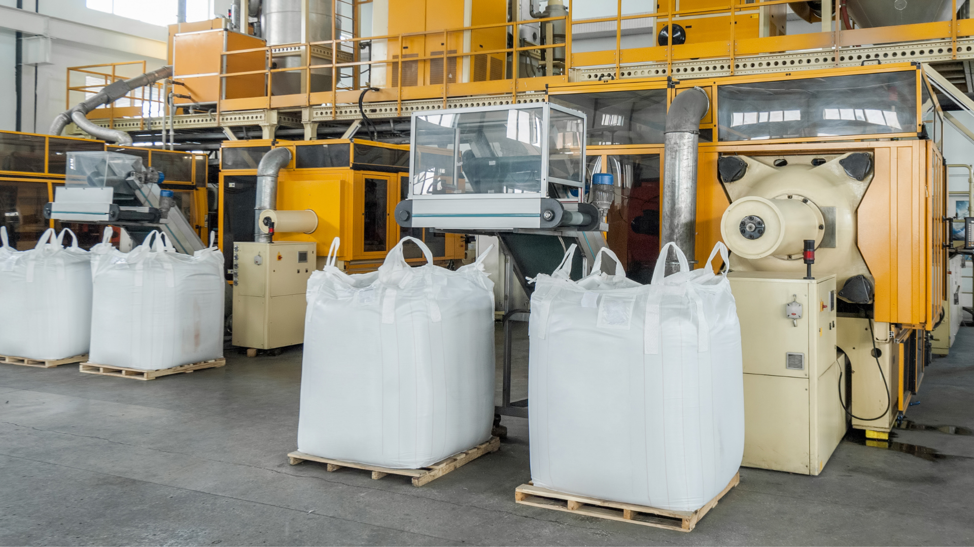 A factory filled with lots of bags and machinery.