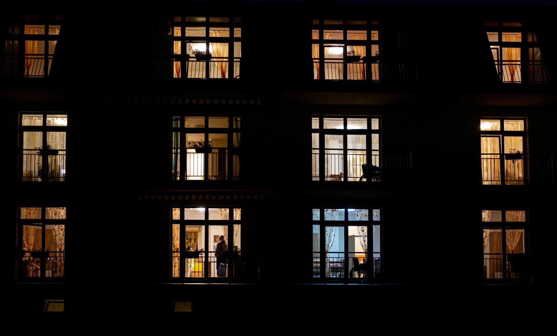 Illuminated Windows Of Night House With People Inside - Hendersonville, NC - Tucker Heating & Air