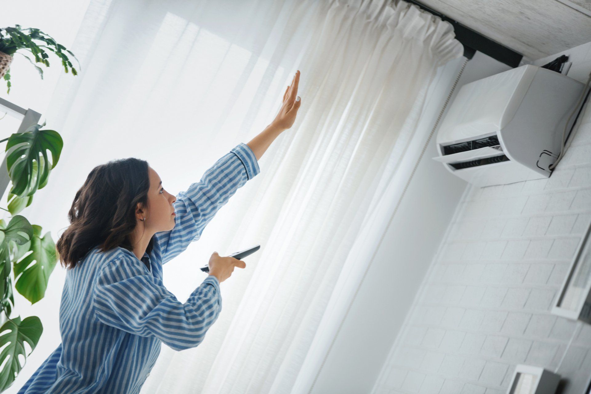 Turning On The Air Conditioner - Hendersonville, NC - Tucker Heating & Air