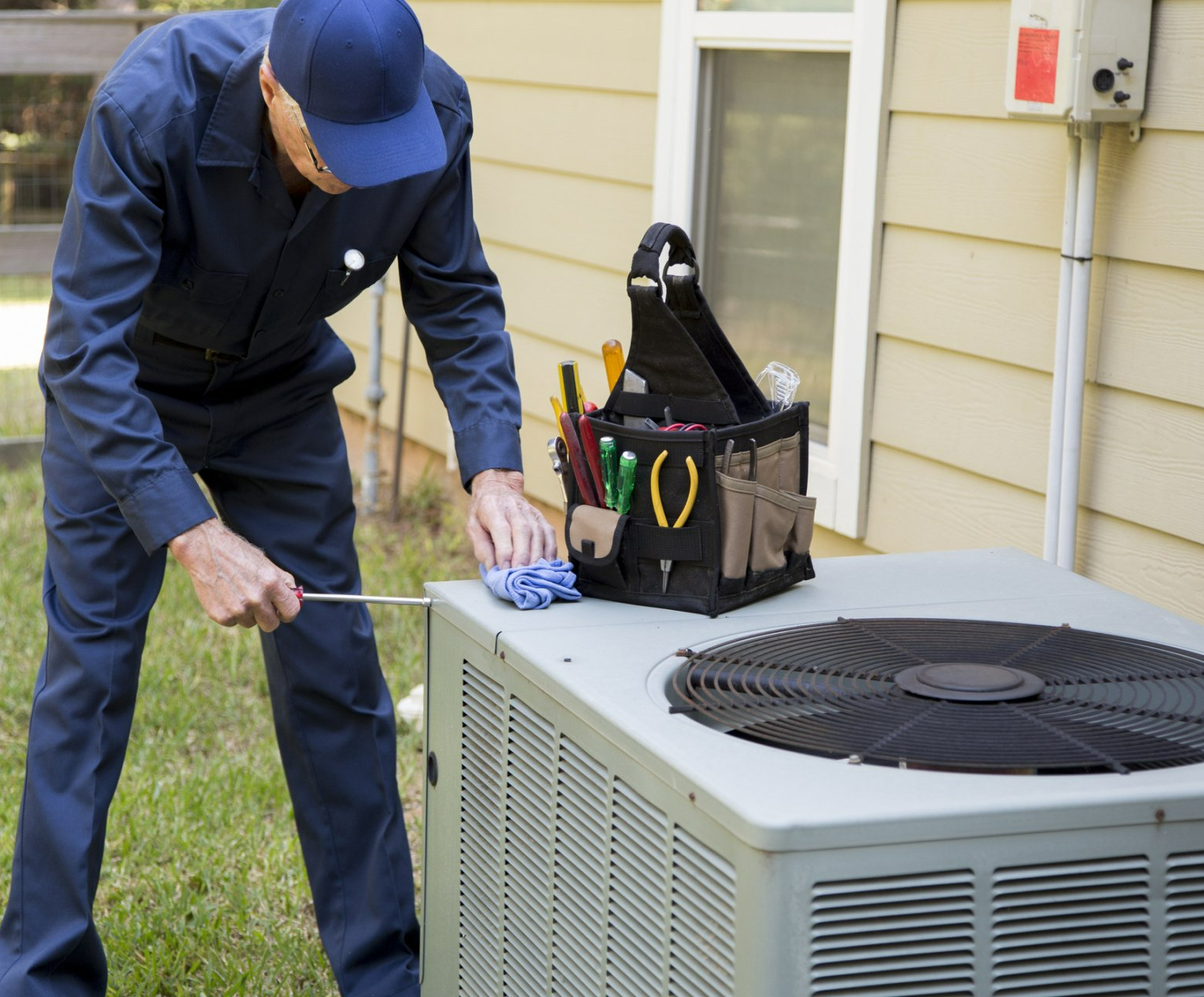 Technician Services Outside AC Units And Generator - Hendersonville, NC - Tucker Heating & Air