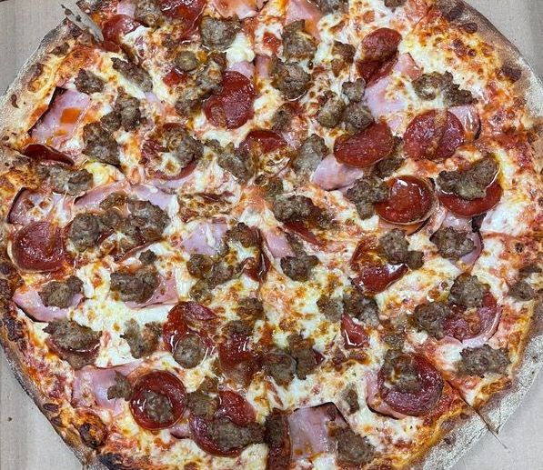 A pizza with a lot of toppings on it