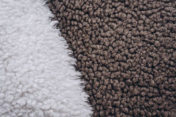 A close up of a brown and white carpet.