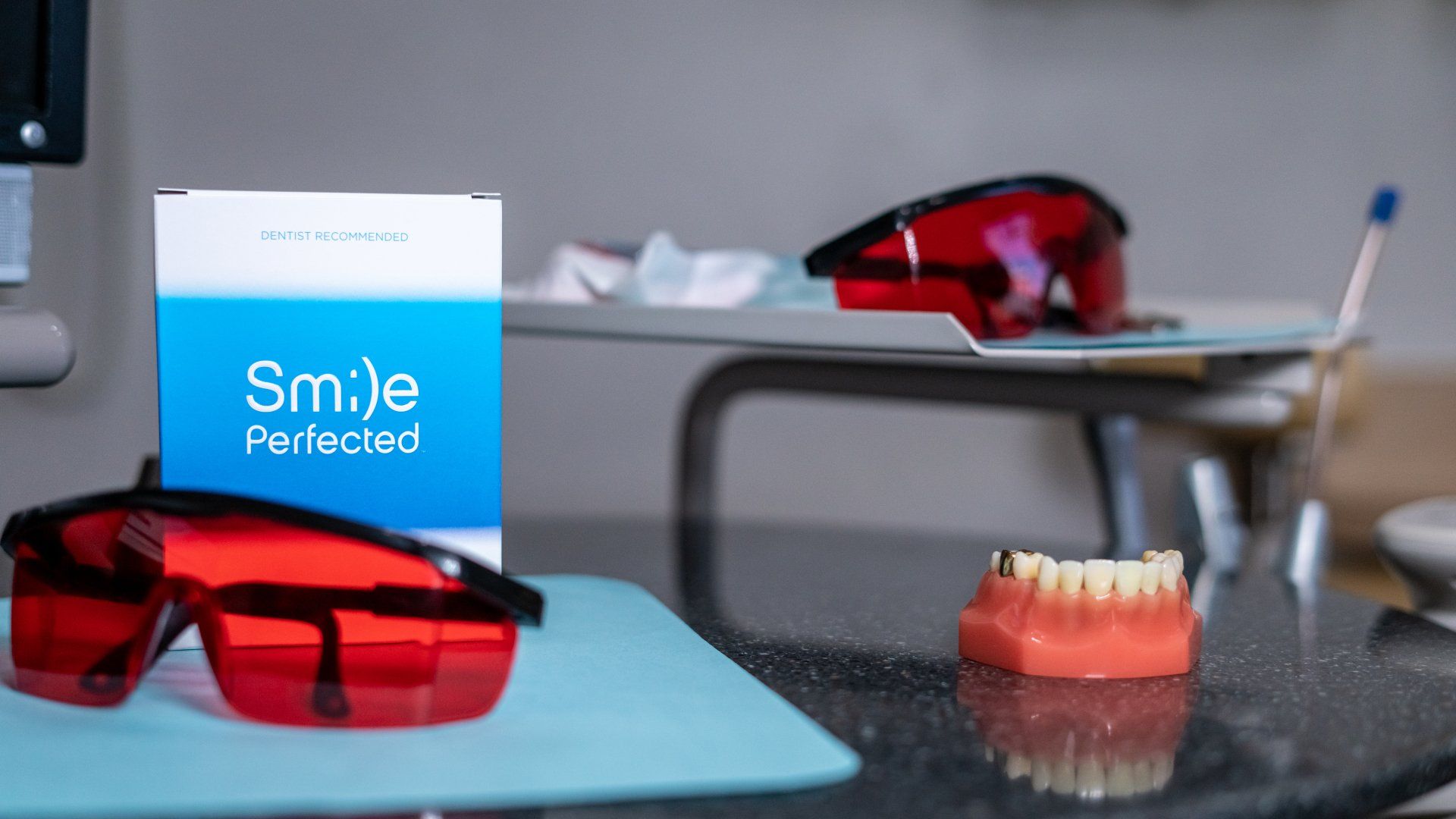 A dental office with a box that says smile perfected on it