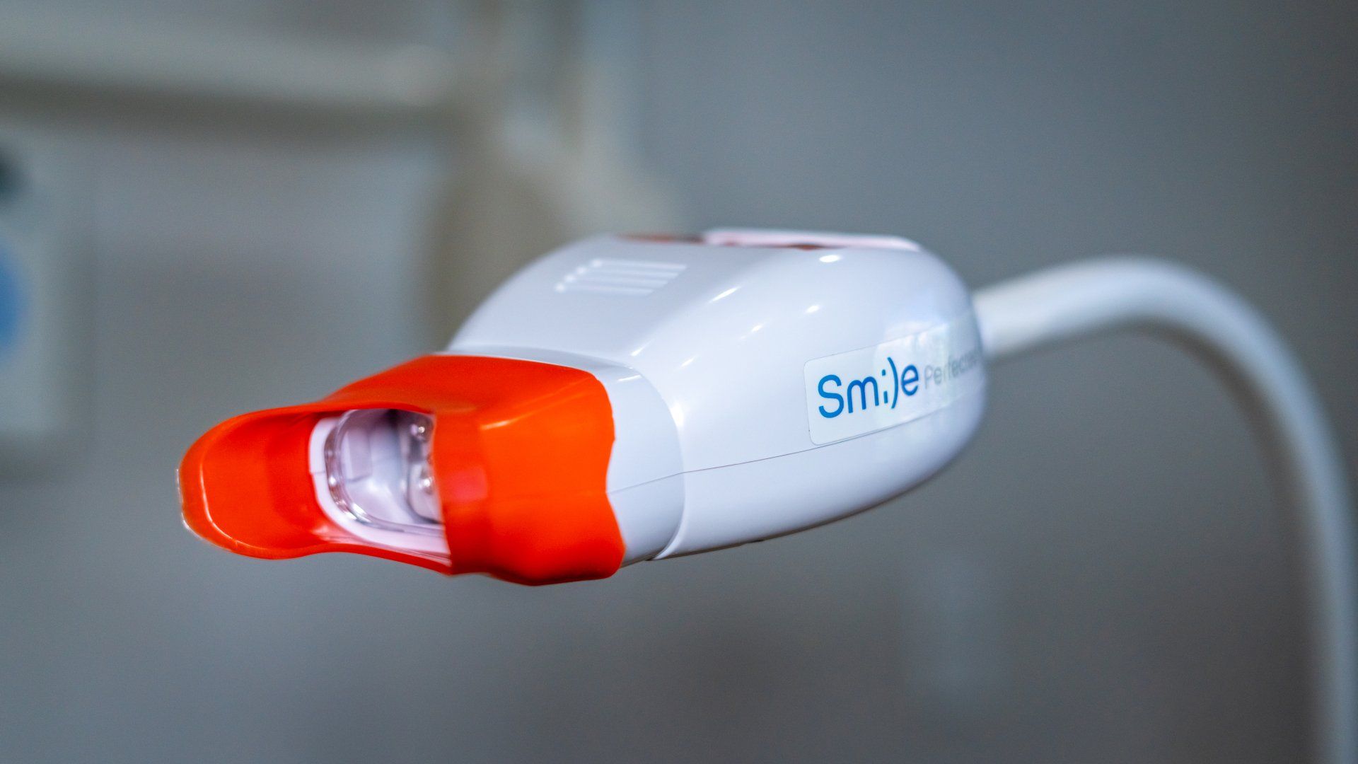 A close up of a tooth whitening machine in a dental office.