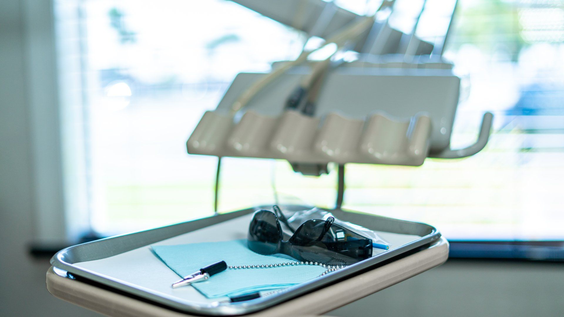 A tray with dental instruments on it in a dental office.