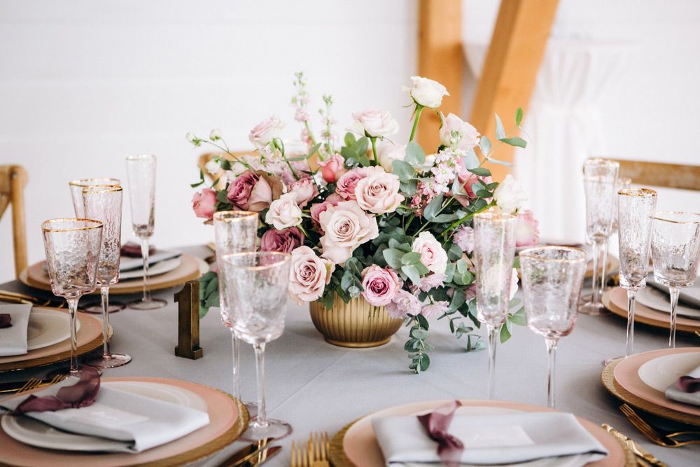 A Table Set for A Wedding with Plates, Glasses, and A Vase of Flowers — Pick-A-Bunch Florists & Gifts In Sarina, QLD
