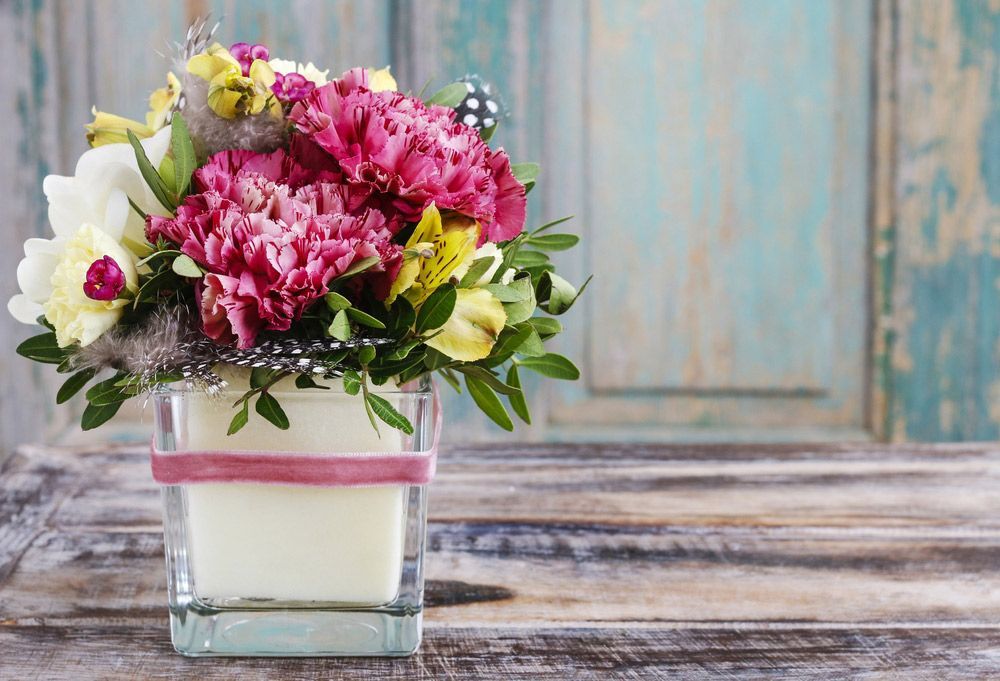 A Vase Filled with Flowers Is Sitting on A Wooden Table — Pick-A-Bunch Florists & Gifts In Koumala, QLD