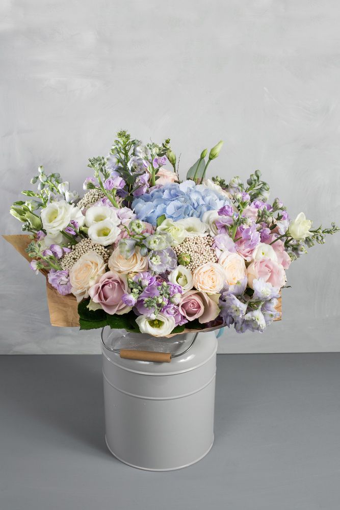 A Bouquet of Flowers in A White Box on A Table — Pick-A-Bunch Florists & Gifts In Hay Point, QLD