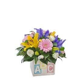 A Bouquet of Flowers in A Vase with Alphabet Blocks — Pick-A-Bunch Florists & Gifts In Sarina, QLD