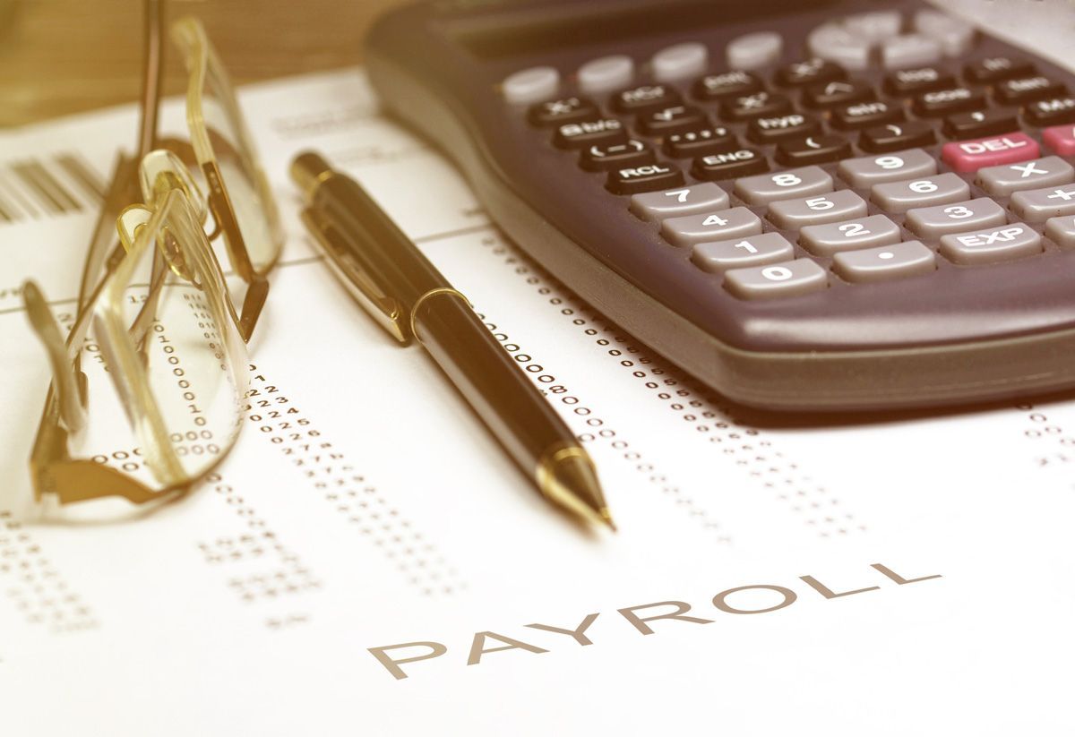 Pen, Calculator and Reading Glasses on Financial Documents — Schofield, WI — Star Tax & Accounting