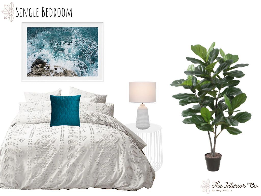 A bedroom with a bed , lamp , and plant.